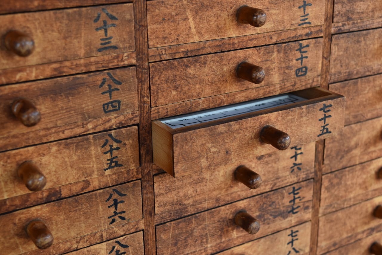 services-bg Close-up of wooden drawers with Japanese characters in a Tokyo temple.